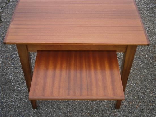 A Gordon Russell teak extending dining table and six chairs (4+2 carvers)